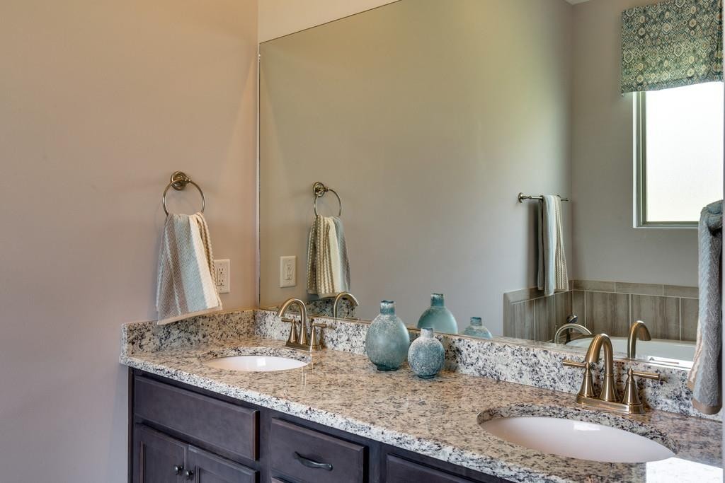 53 Saddle Ridge Mount Mount Juliet, TN 37122 - Photo 18 of 23 a bathroom with a granite countertop sink and a mirror