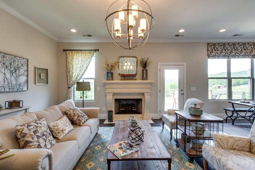 53 Saddle Ridge Mount Mount Juliet, TN 37122 - Photo 9 of 23 a living room with furniture a fireplace and a large window