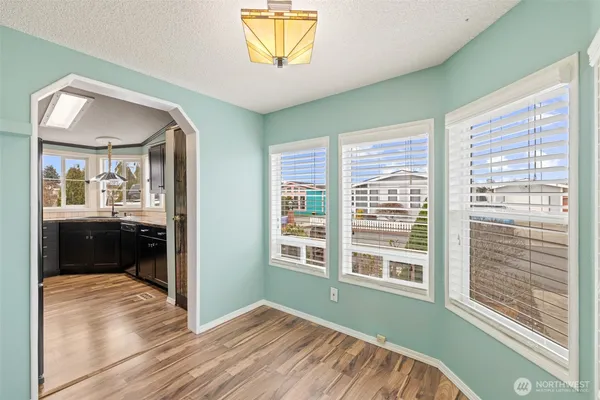 a view of a room that has a bed in it