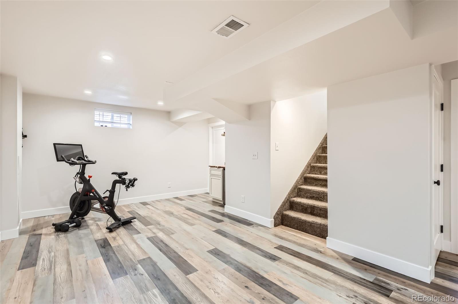 7120 Galapago Street Denver, CO 80221 - Photo 18 of 30 a view of a room with gym equipment