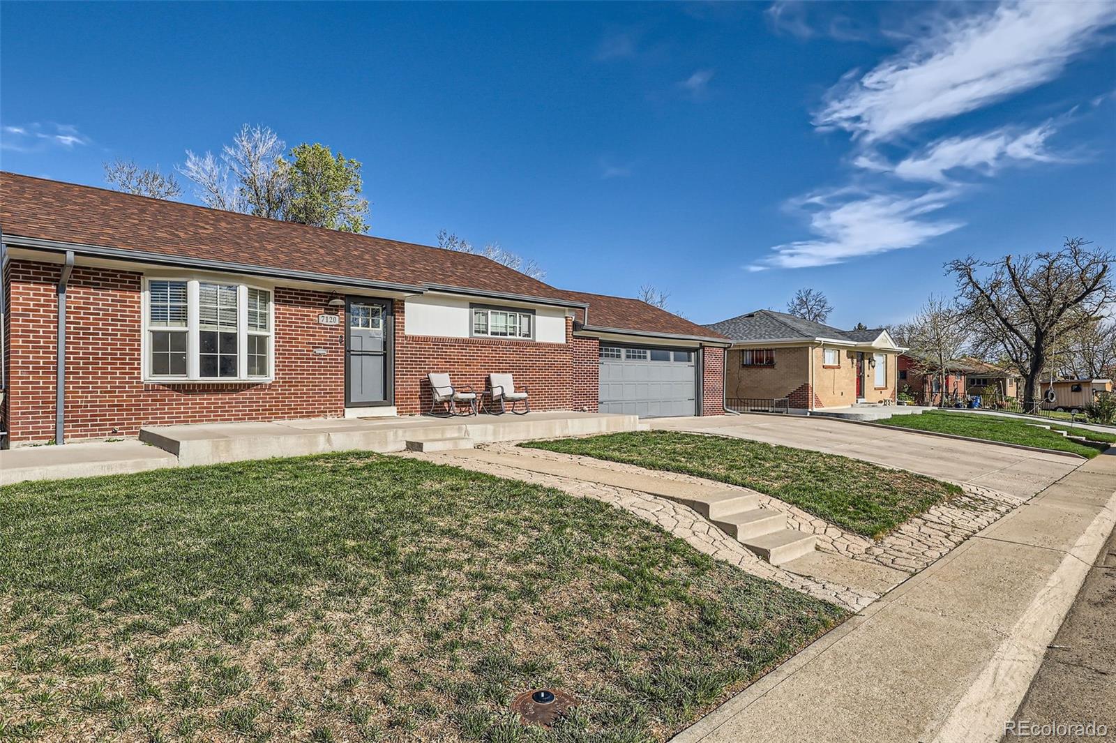 7120 Galapago Street Denver, CO 80221 - Photo 2 of 30 a front view of a house with a yard