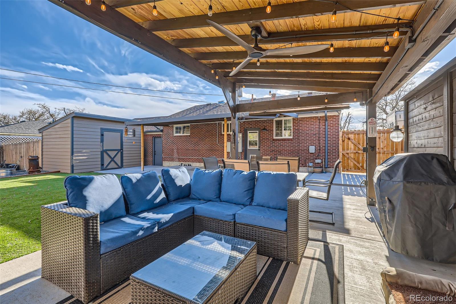 7120 Galapago Street Denver, CO 80221 - Photo 25 of 30 a outdoor living space with furniture and a garden