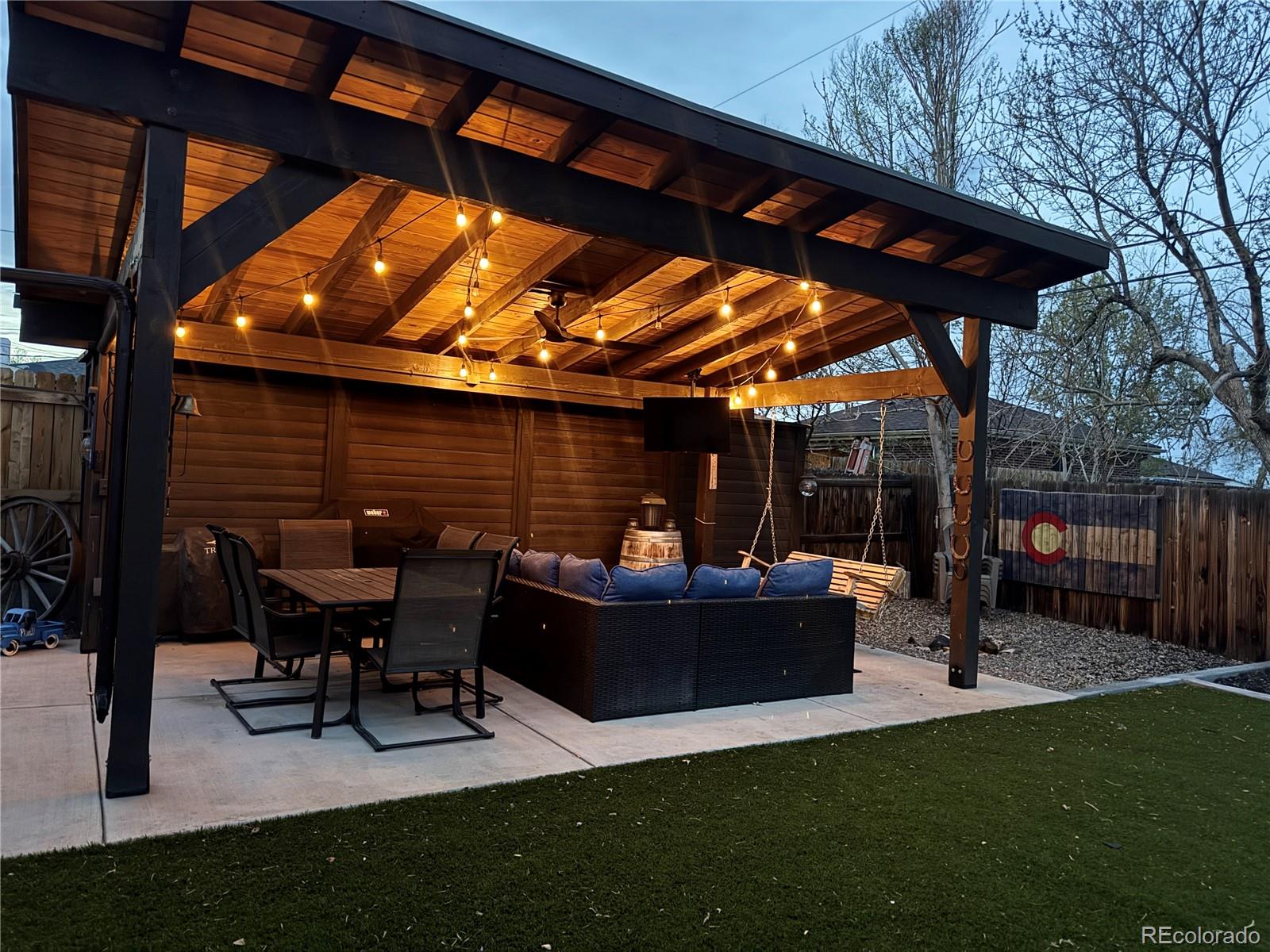 7120 Galapago Street Denver, CO 80221 - Photo 29 of 30 a view of patio with table and chairs under an umbrella with a barbeque