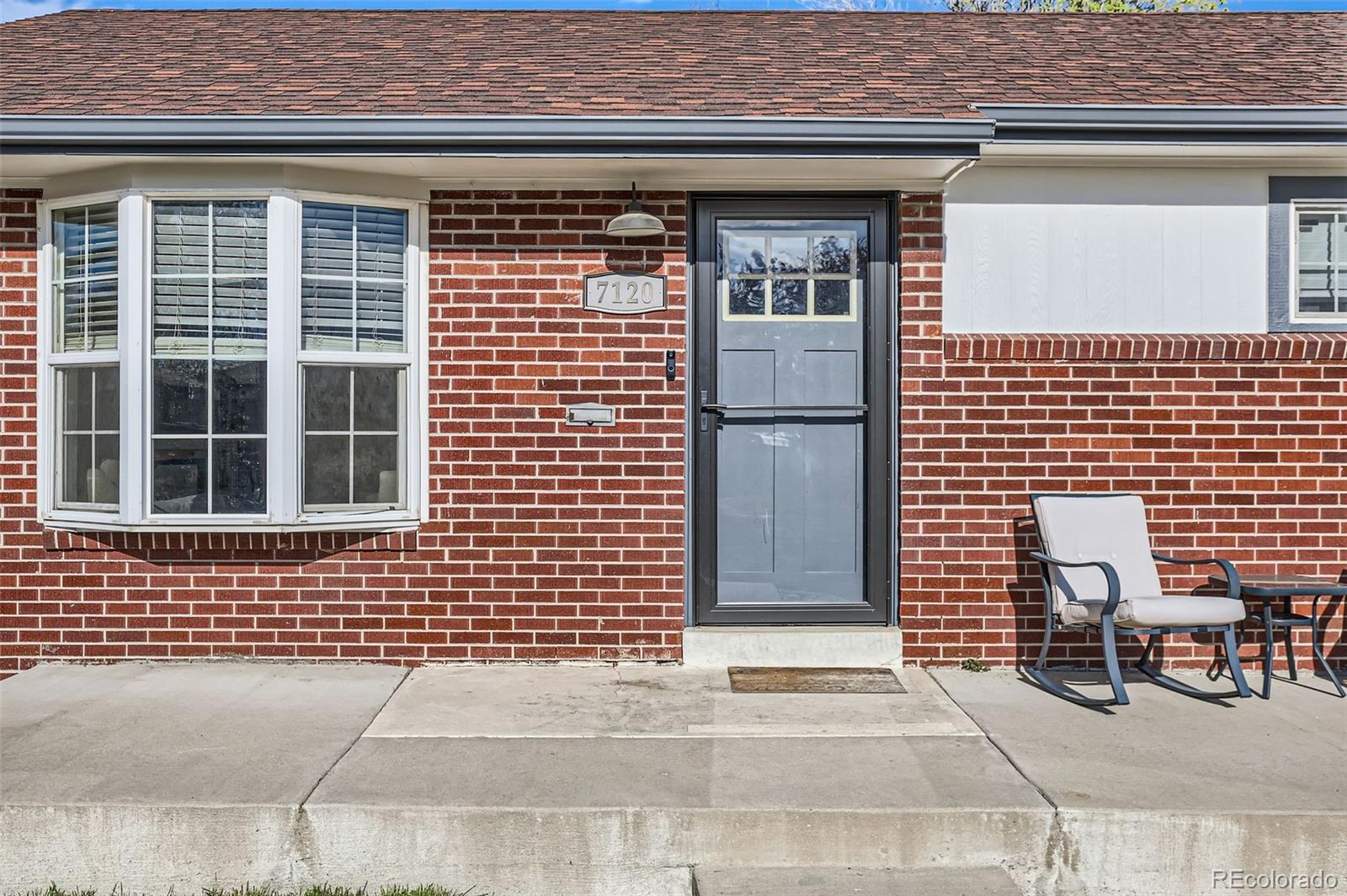 7120 Galapago Street Denver, CO 80221 - Photo 3 of 30 a view of a brick house with large windows