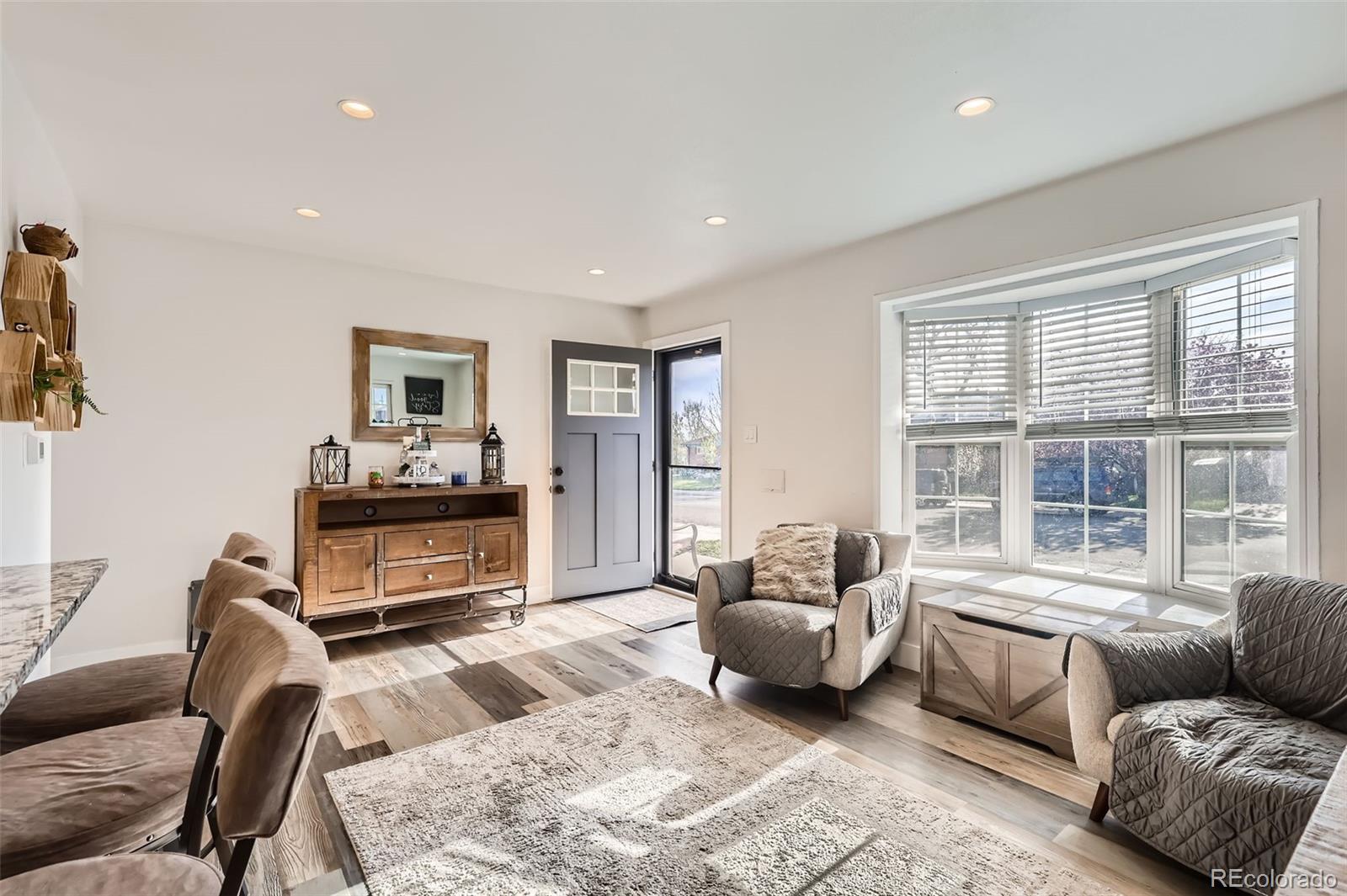 7120 Galapago Street Denver, CO 80221 - Photo 4 of 30 a bedroom with furniture and a large window