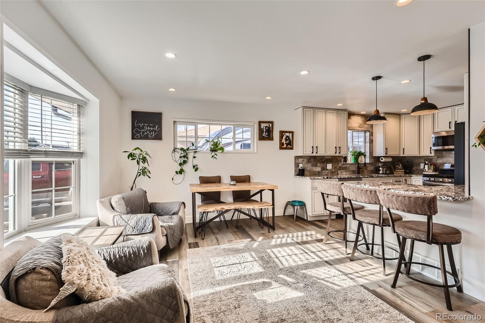 7120 Galapago Street Denver, CO 80221 - Photo 5 of 30 a living room with furniture and a large window