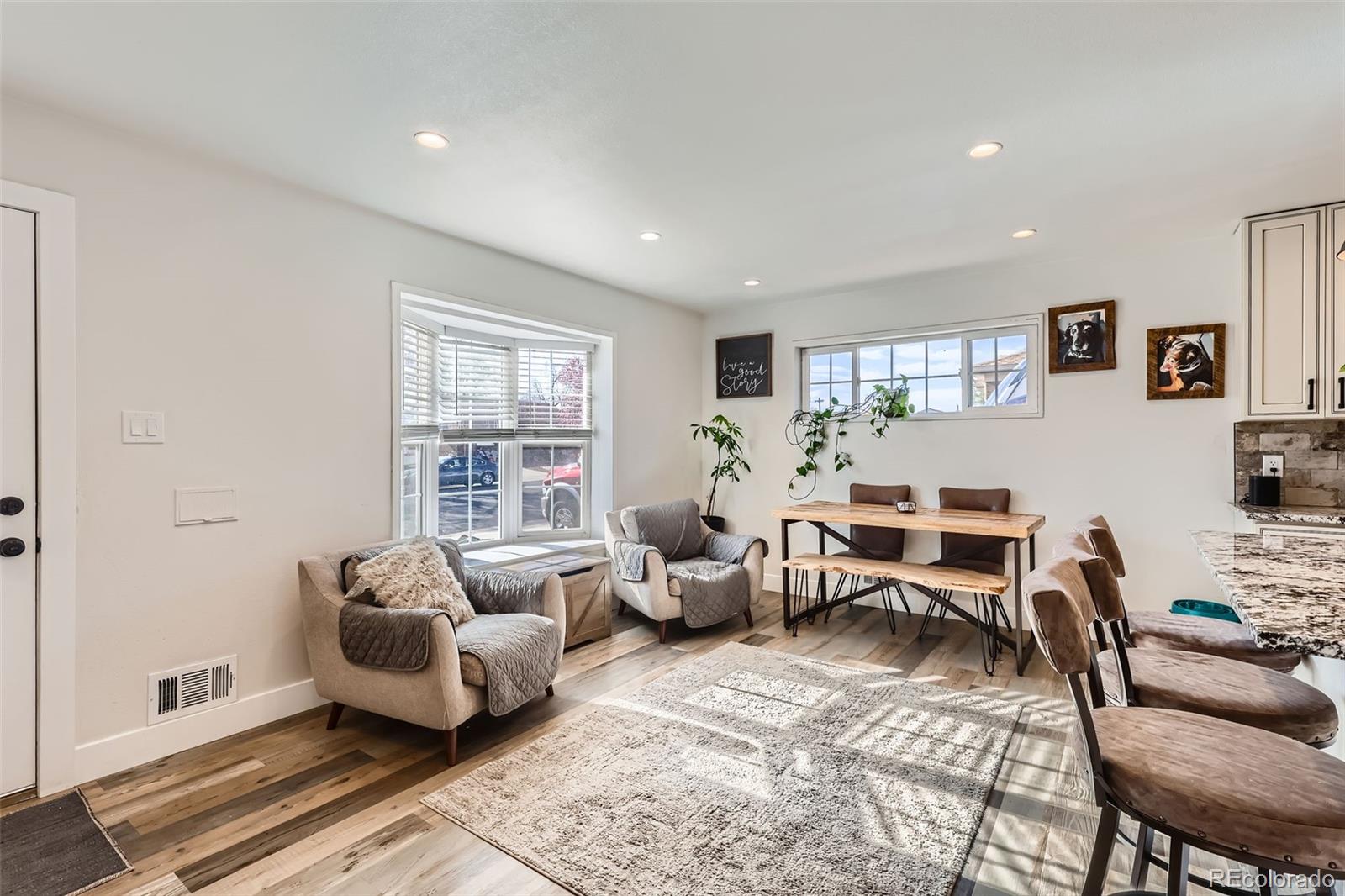 7120 Galapago Street Denver, CO 80221 - Photo 6 of 30 a living room with furniture wooden floor and a window