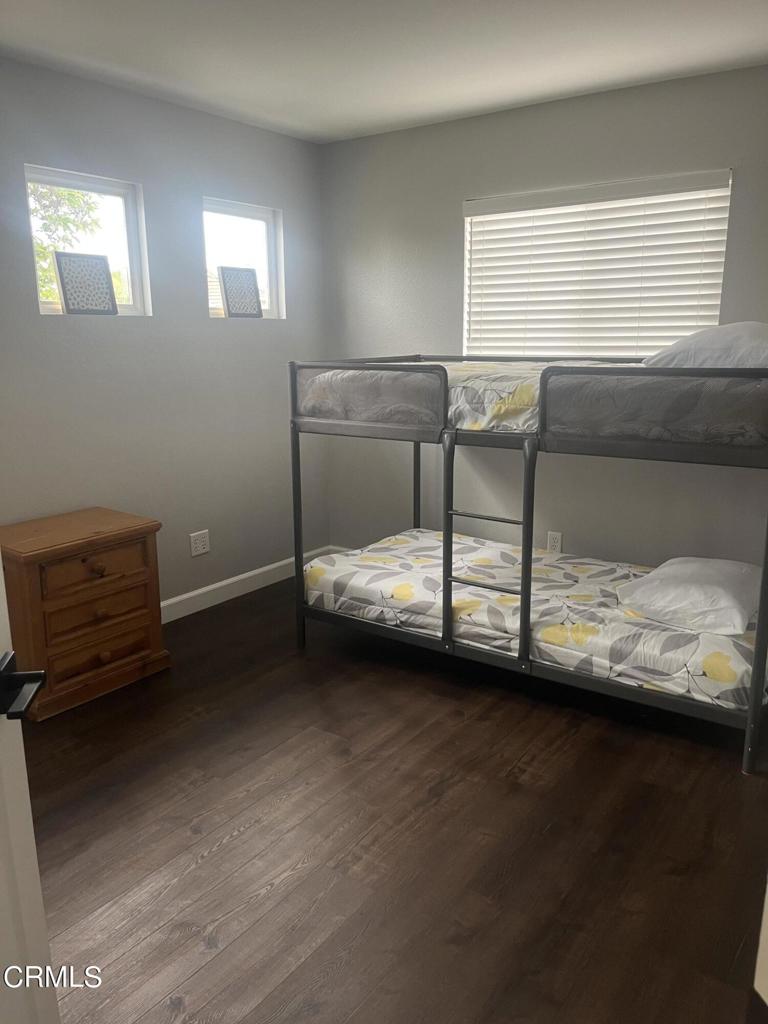 1027 Corte Primavera Oxnard, CA 93030 - Photo 16 of 23 a bedroom with a bed and a window