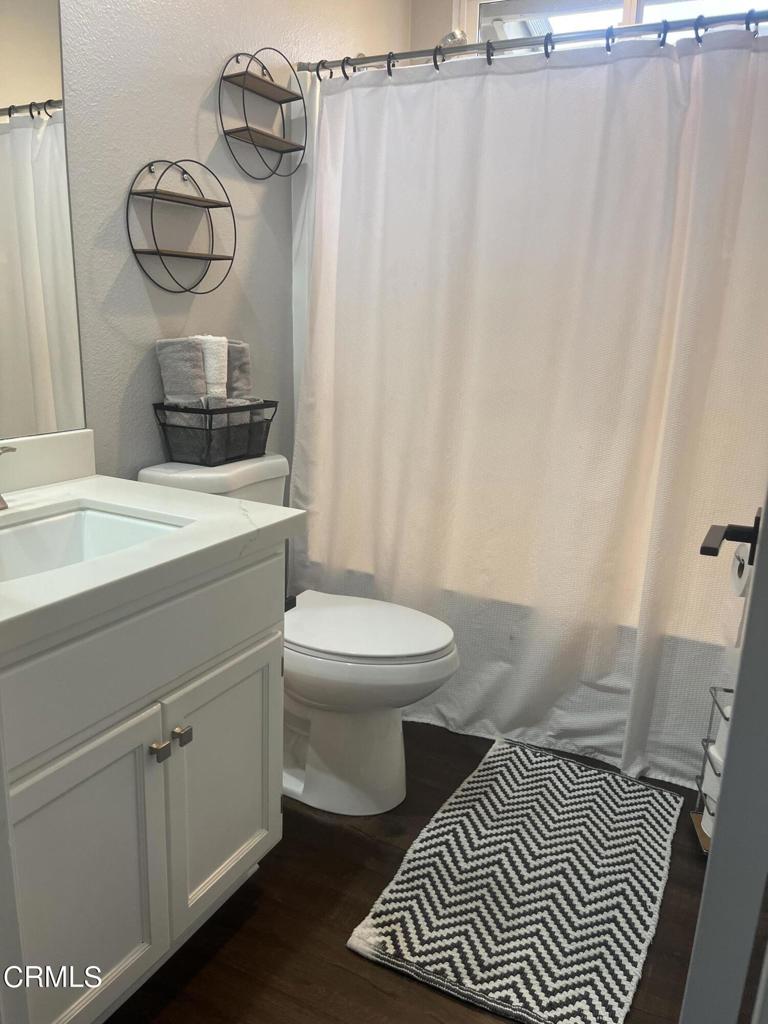 1027 Corte Primavera Oxnard, CA 93030 - Photo 19 of 23 a bathroom with a sink toilet and shower