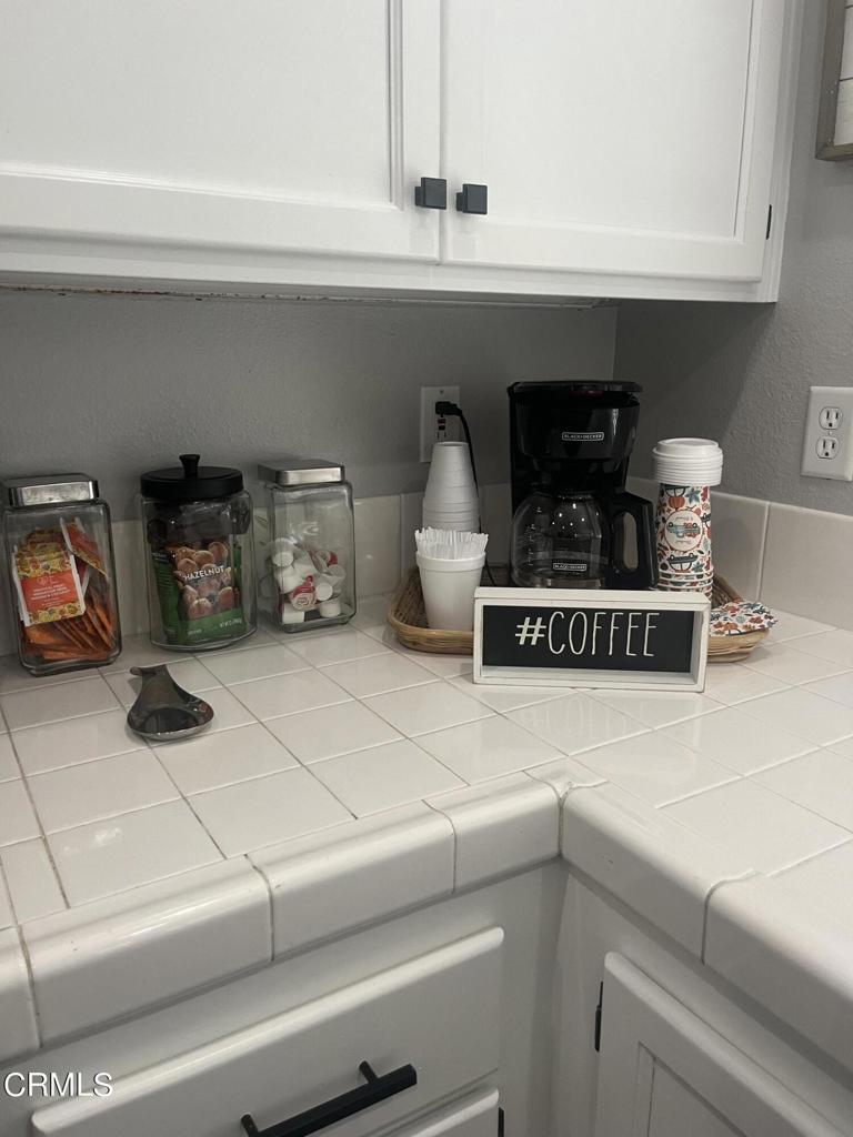 1027 Corte Primavera Oxnard, CA 93030 - Photo 5 of 23 a kitchen with a stove and a refrigerator
