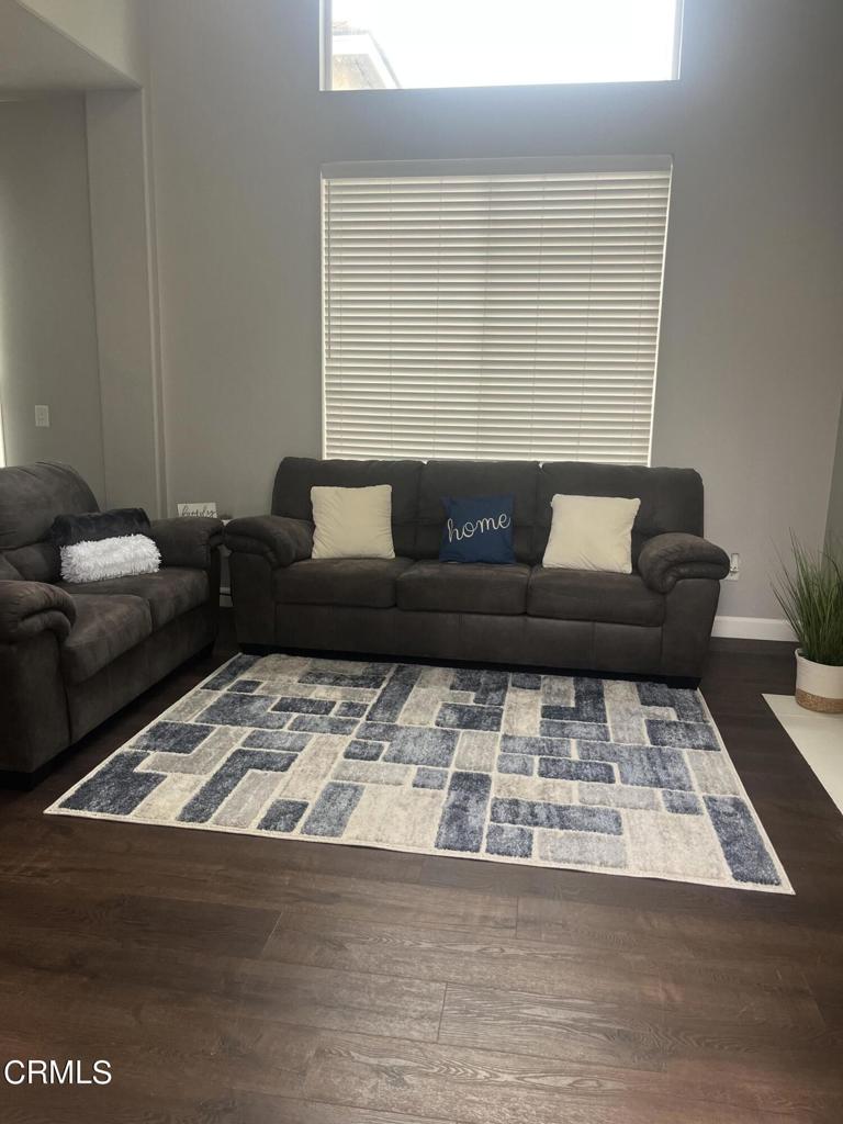 1027 Corte Primavera Oxnard, CA 93030 - Photo 7 of 23 a living room with furniture and a rug