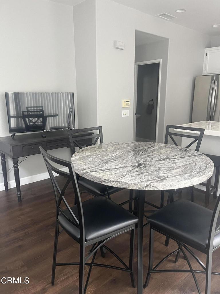1027 Corte Primavera Oxnard, CA 93030 - Photo 9 of 23 a view of a dining room with furniture