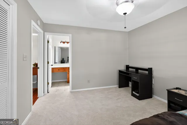 a white toilet sitting next to a shower curtain