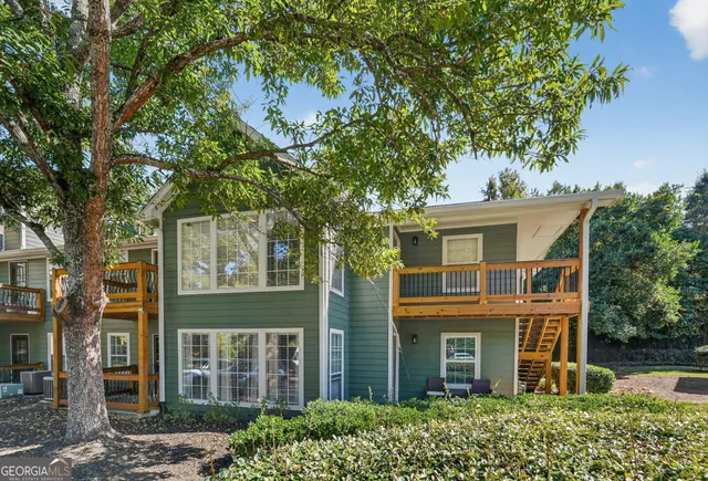 front view of a house with a tree