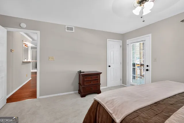 a view of a hallway with front door and furniture