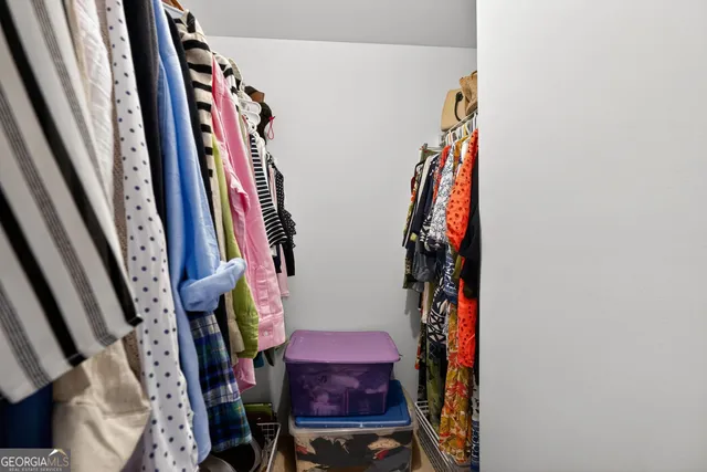 a bathroom with a sink a toilet and shower curtain