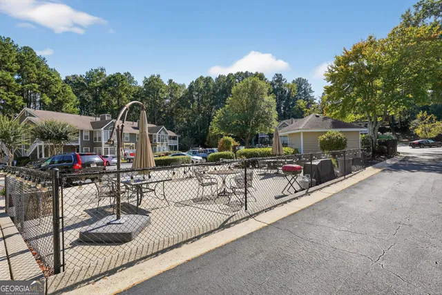 a view of a swimming pool with chairs