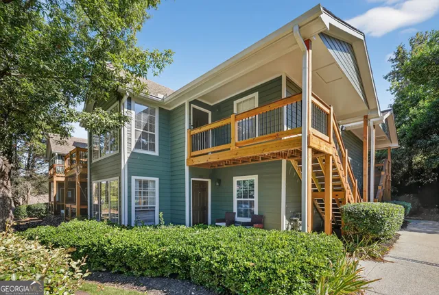 front view of a brick house with a small yard