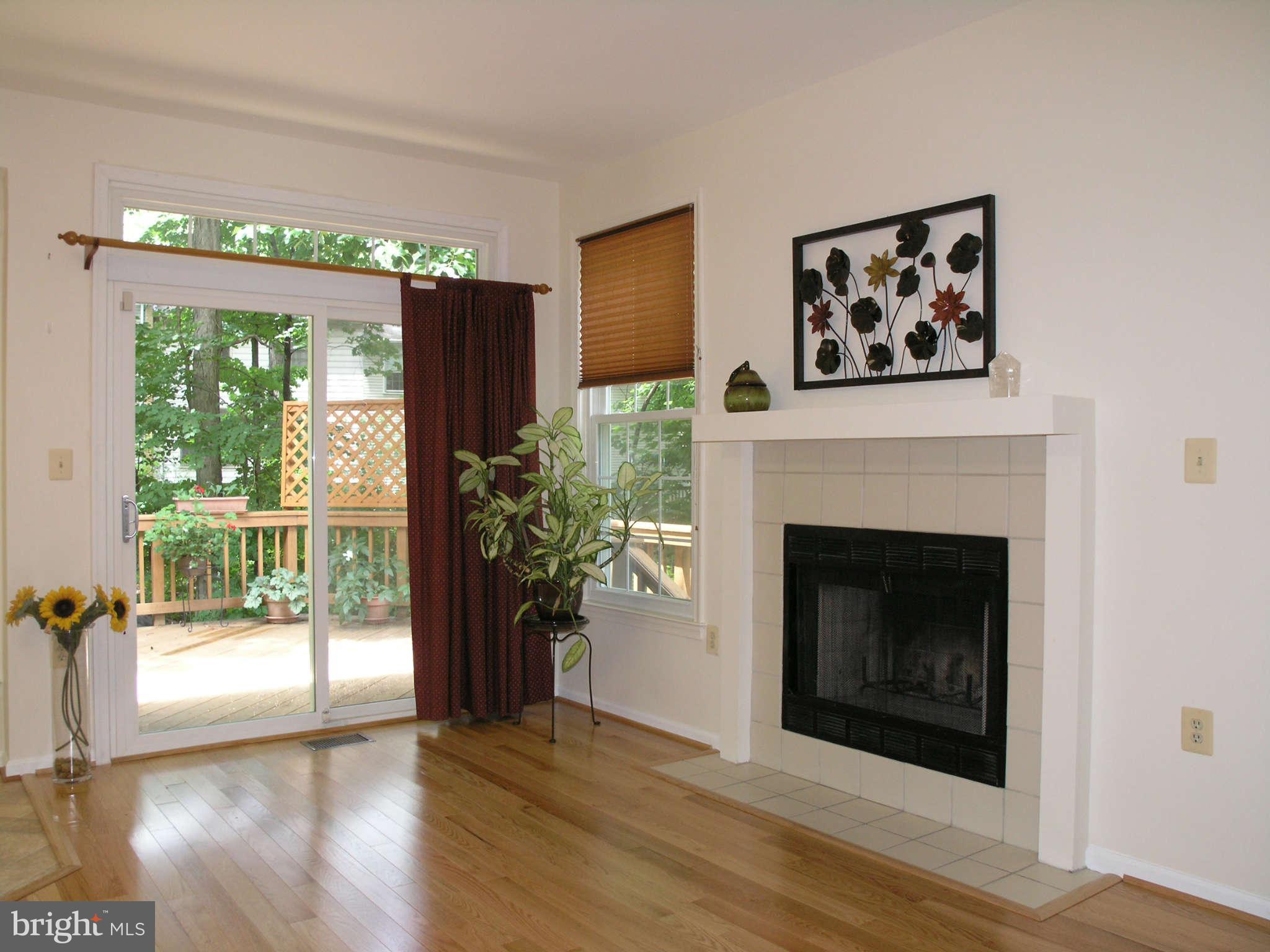 11294 Fairwind Way Reston, VA 20190 - Photo 11 of 30 a view of a livingroom with a fireplace wooden floor and a fireplace
