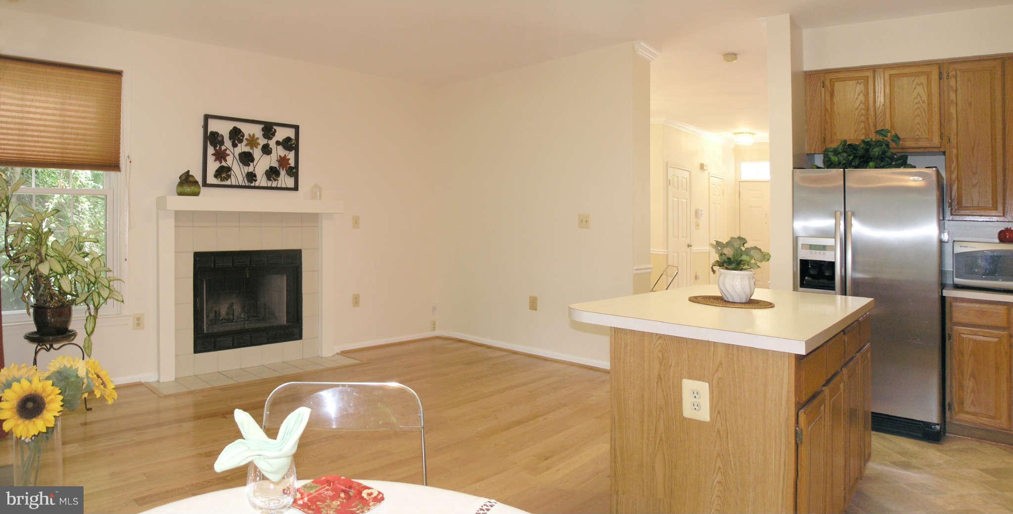 11294 Fairwind Way Reston, VA 20190 - Photo 18 of 30 a kitchen with a sink refrigerator and microwave