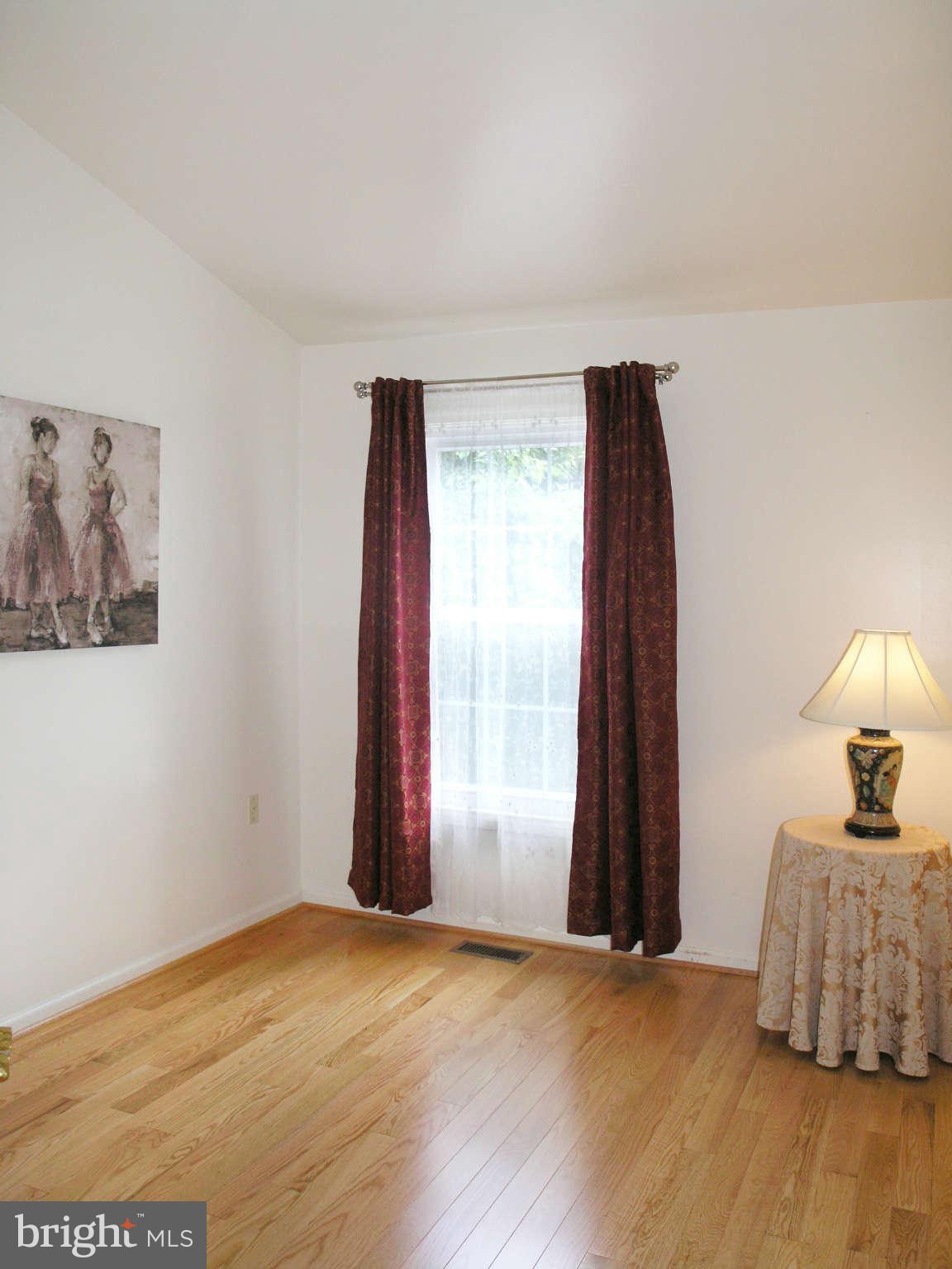11294 Fairwind Way Reston, VA 20190 - Photo 25 of 30 a view of a room with wooden floor and a window