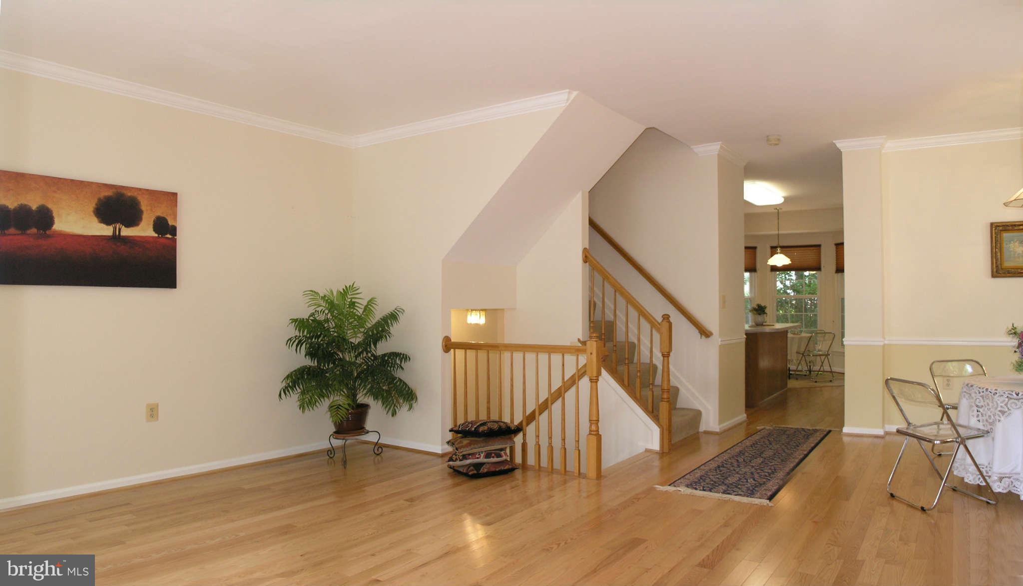11294 Fairwind Way Reston, VA 20190 - Photo 9 of 30 a view of a livingroom with wooden floor and furniture