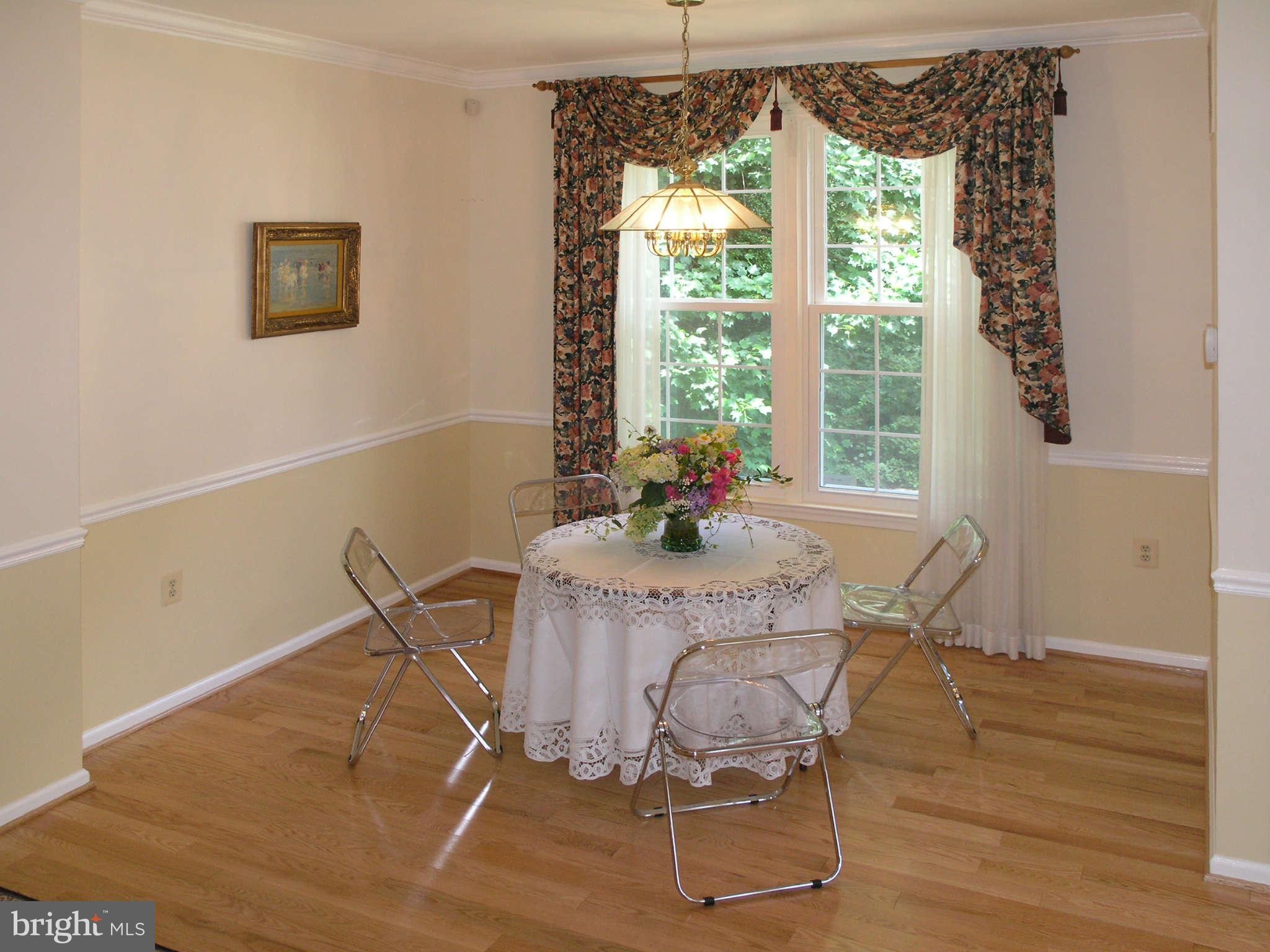 11294 Fairwind Way Reston, VA 20190 - Photo 10 of 30 a dining room with furniture and wooden floor