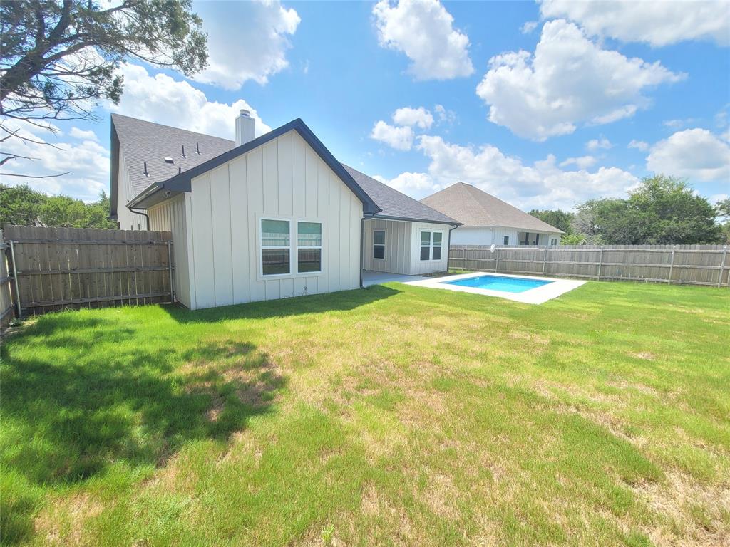 4825 Wichita Street Granbury, TX 76048 - Photo 1 of 30 a view of a house with a yard and sitting area