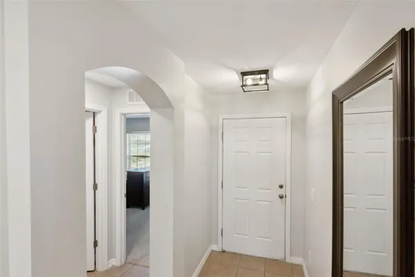 a view of a hallway with two rooms