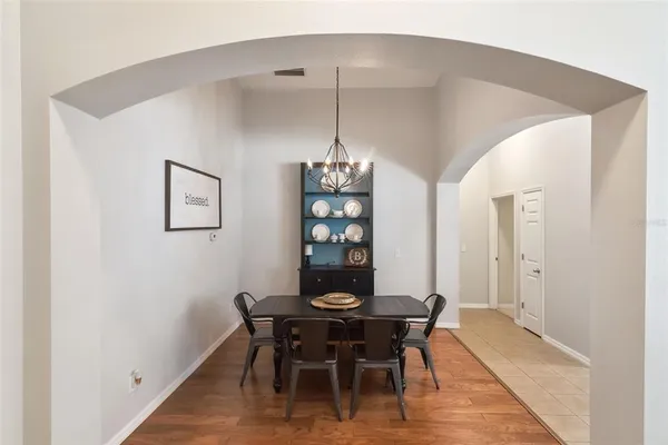 a dining room with furniture and window
