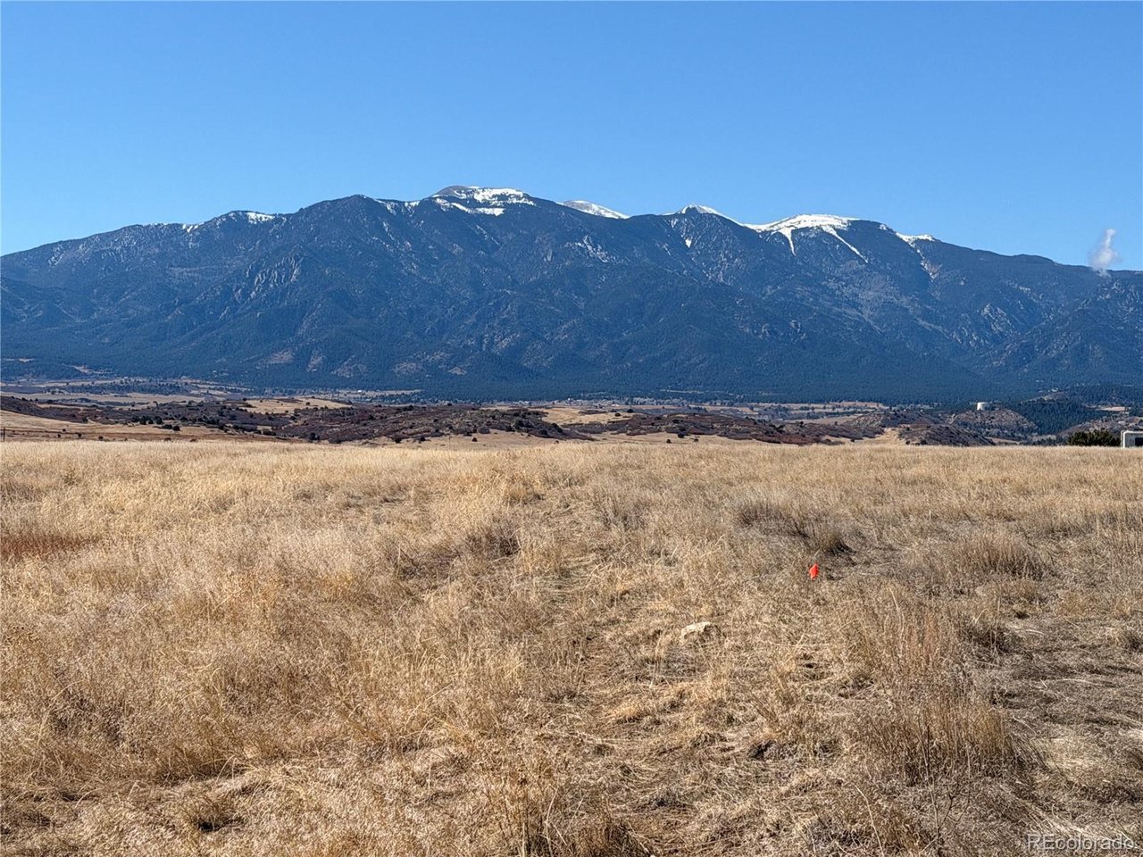 168 East Routt Street Colorado City, CO 81019 - Photo 1 of 7 a view of a yard with a mountain in the background