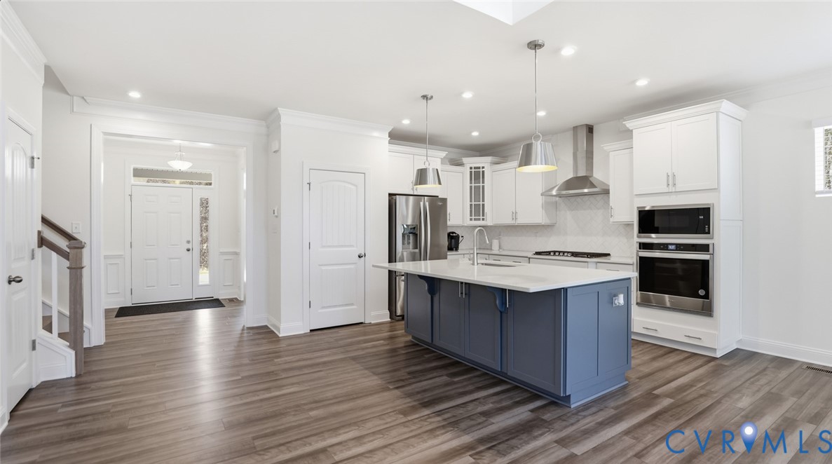 3726 Rocketts Ridge Drive Goochland, VA 23063 - Photo 3 of 38 he welcoming foyer opens to a formal dining room,