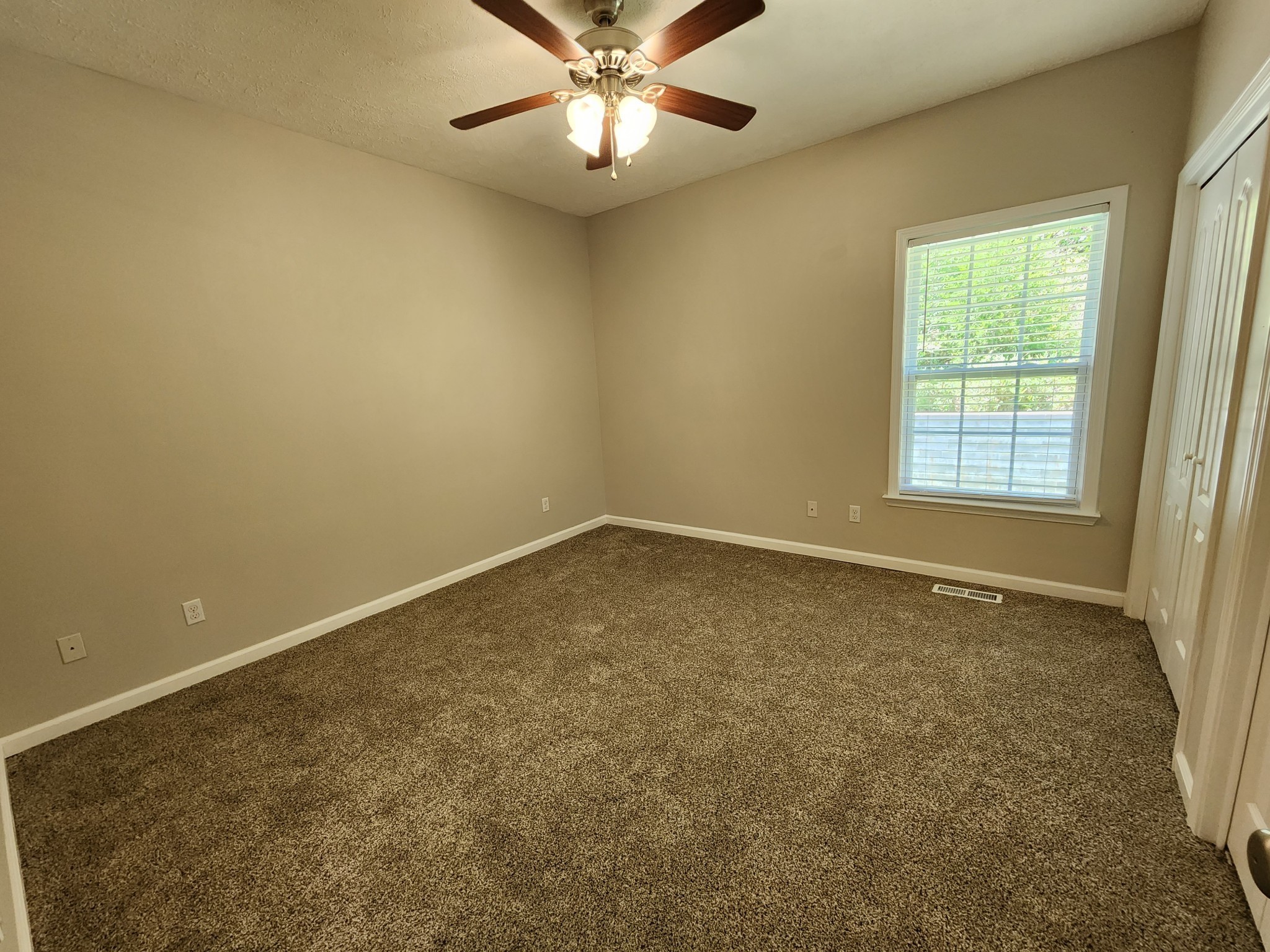 1415 Williamson Road, Unit B Goodlettsville, TN 37072 - Photo 12 of 18 an empty room with a window and a fan