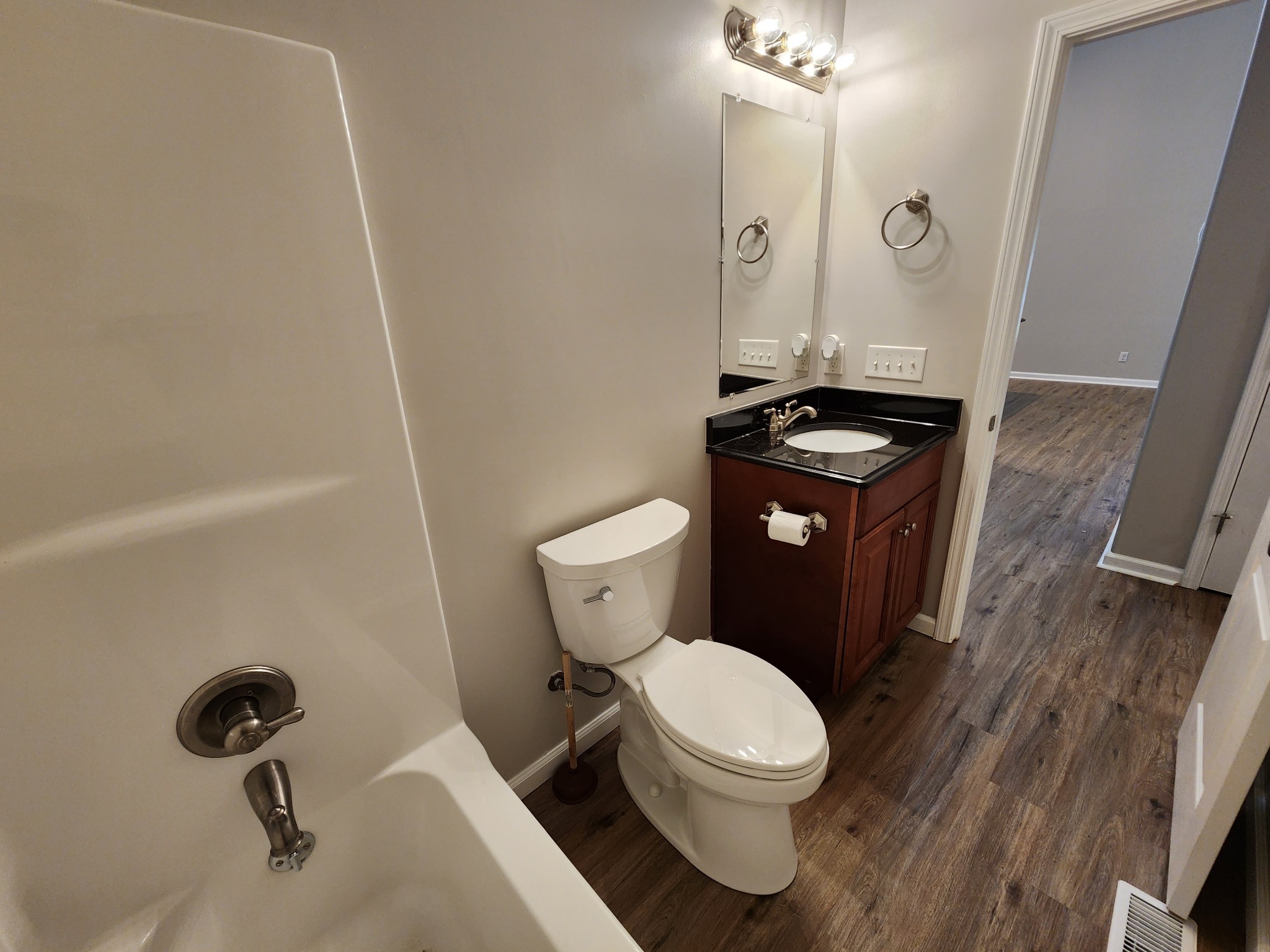 1415 Williamson Road, Unit B Goodlettsville, TN 37072 - Photo 6 of 18 a white toilet sitting next to a bathroom sink