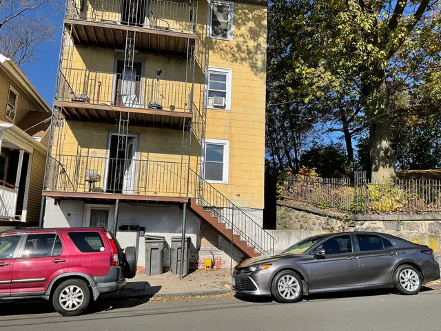 a car parked in front of a house