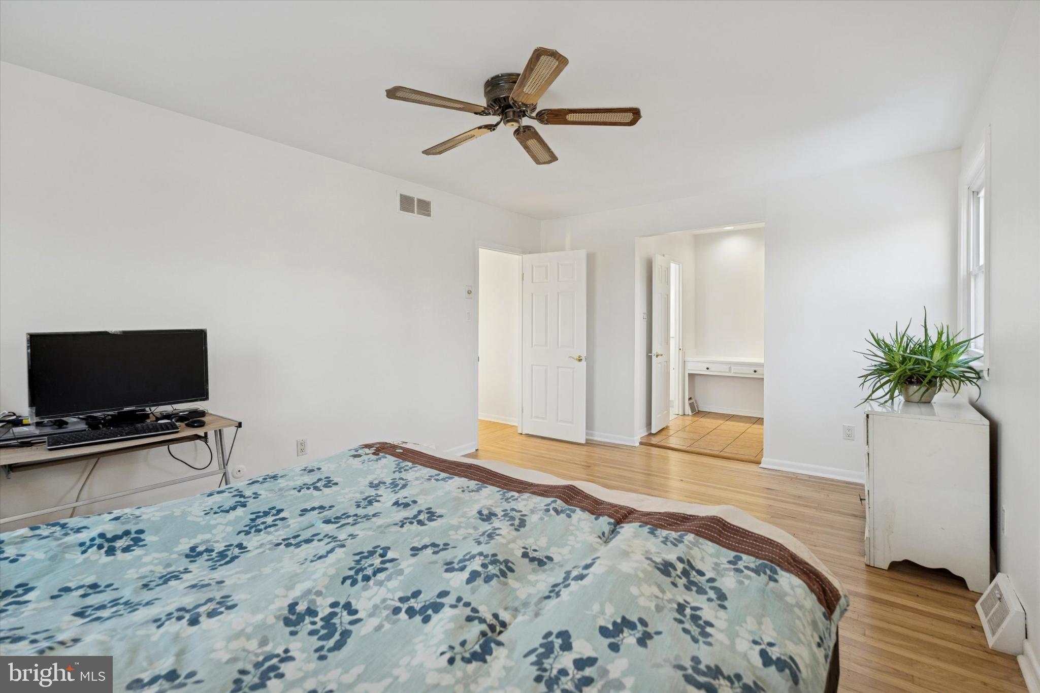 725 Springdell Road King of Prussia, PA 19406 - Photo 17 of 29 a bedroom with a bed and a flat screen tv