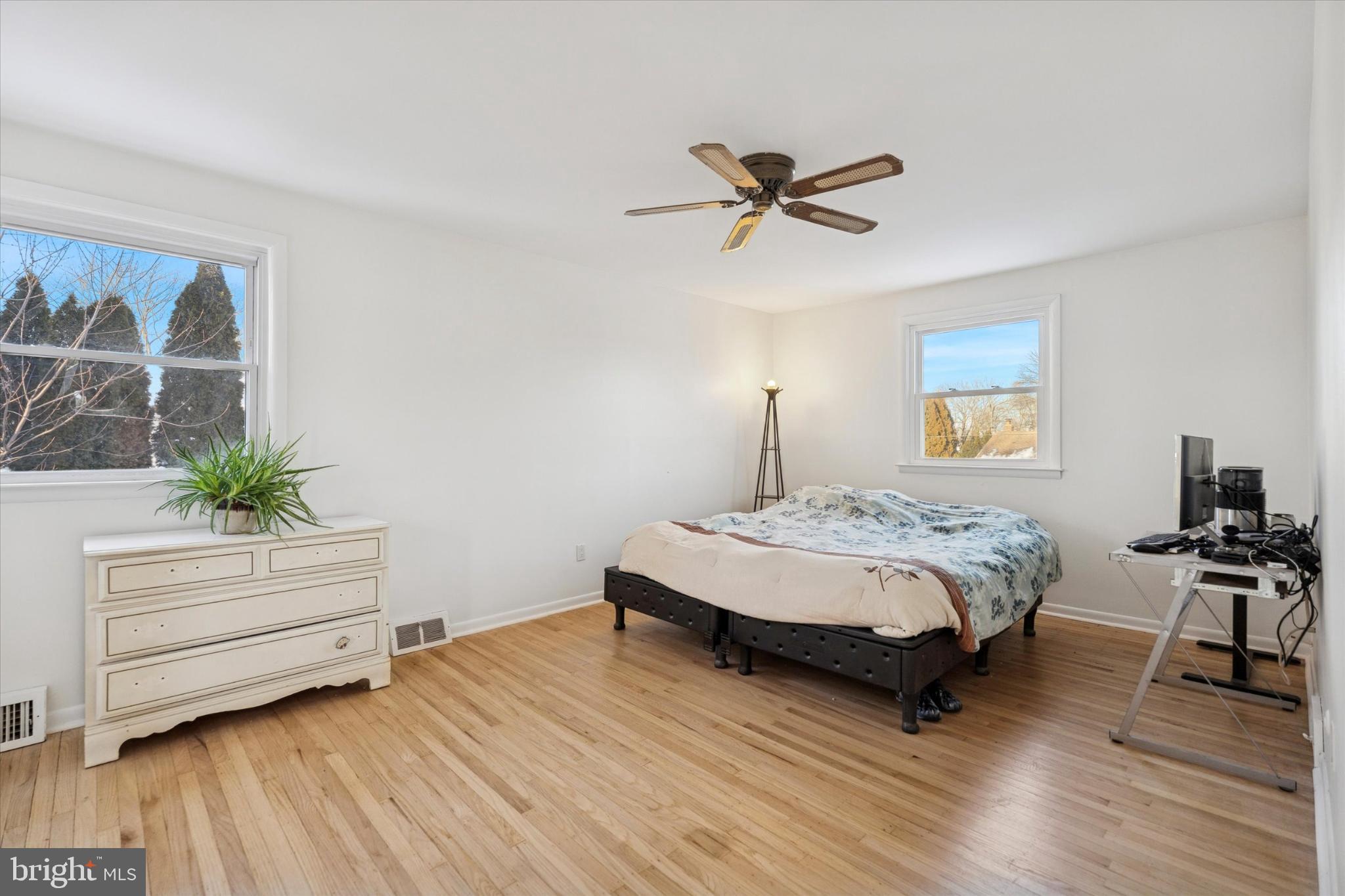 725 Springdell Road King of Prussia, PA 19406 - Photo 18 of 31 a bedroom with a bed and a potted plant