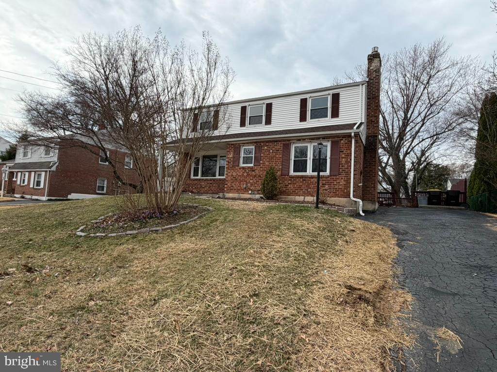 725 Springdell Road King of Prussia, PA 19406 - Photo 3 of 31 a front view of house with yard and trees around