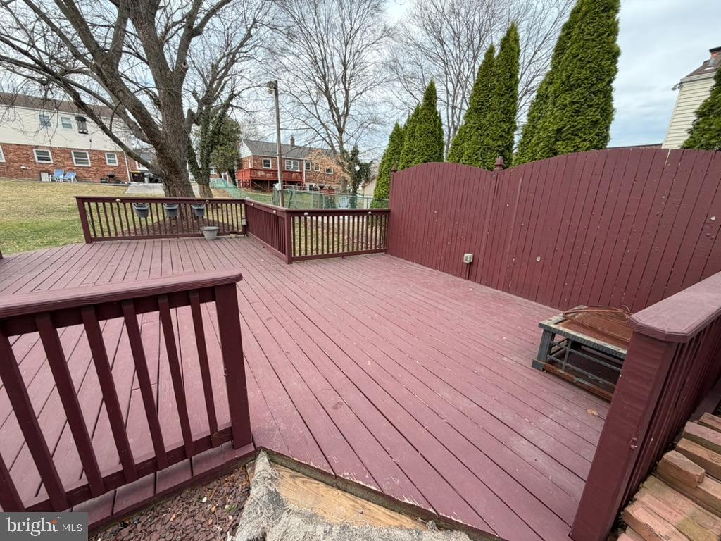 725 Springdell Road King of Prussia, PA 19406 - Photo 5 of 31 a backyard of a house with wooden floor and outdoor seating