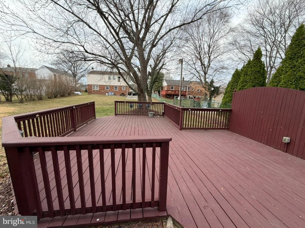 725 Springdell Road King of Prussia, PA 19406 - Photo 6 of 31 a view of a wooden deck and a yard