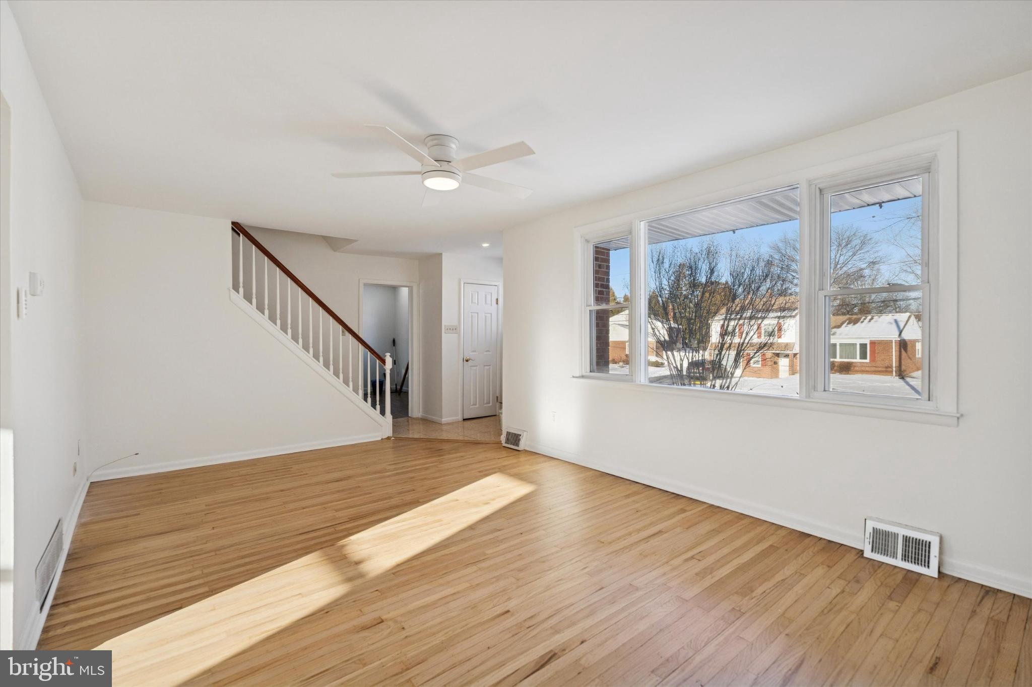 725 Springdell Road King of Prussia, PA 19406 - Photo 8 of 31 a view of empty room with wooden floor and fan