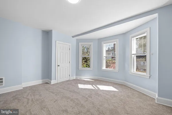 an empty room with windows