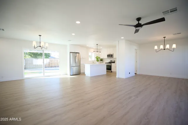 a view of a kitchen with a sink and a stove