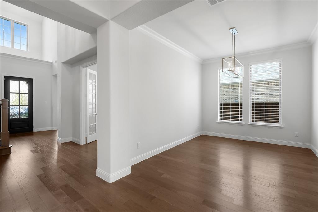 3811 Pepper Grass Lane Prosper, TX 75078 - Photo 17 of 40 an empty room with wooden floor and windows
