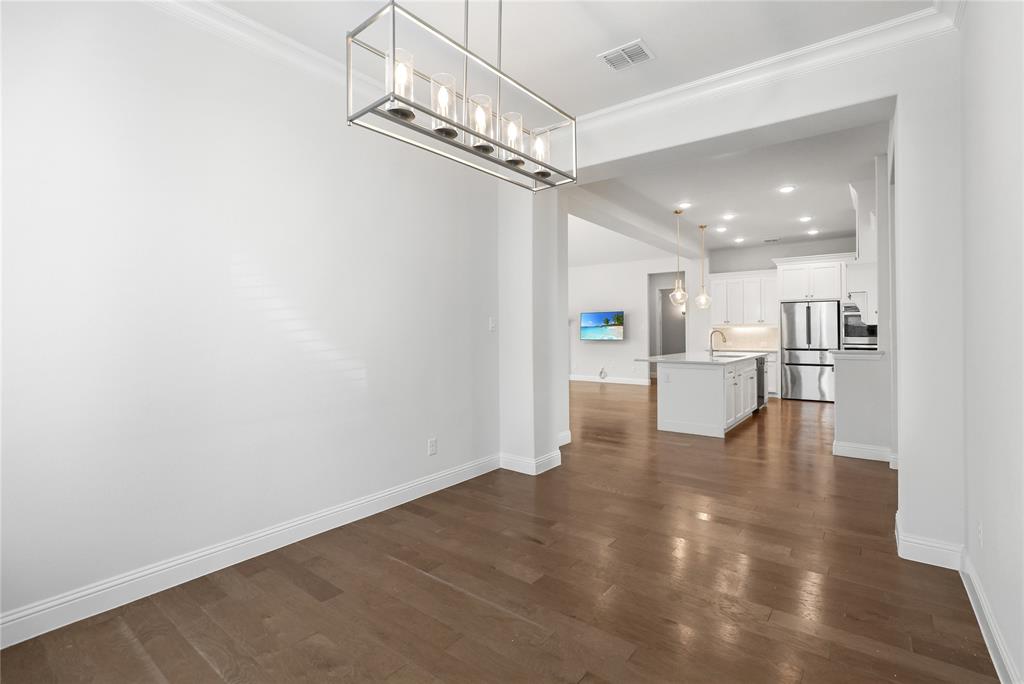3811 Pepper Grass Lane Prosper, TX 75078 - Photo 18 of 40 a view of a kitchen with a white cabinet and a kitchen view