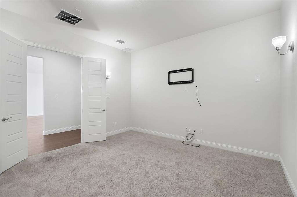 3811 Pepper Grass Lane Prosper, TX 75078 - Photo 29 of 40 a view of a room with an empty space