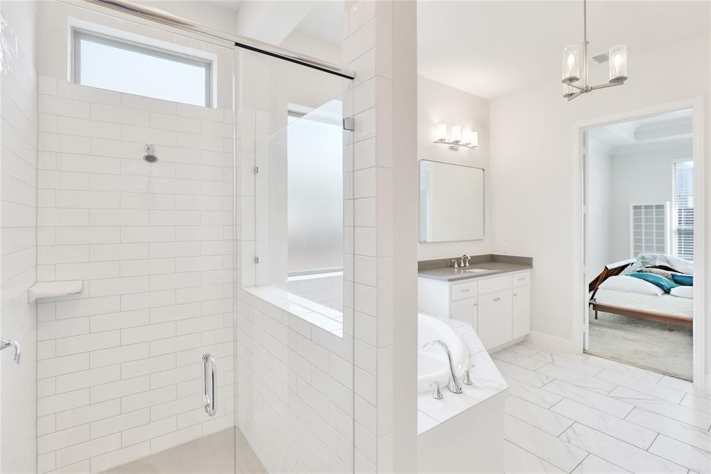 3811 Pepper Grass Lane Prosper, TX 75078 - Photo 32 of 40 a en suite bathroom with a granite countertop tub sink and mirror
