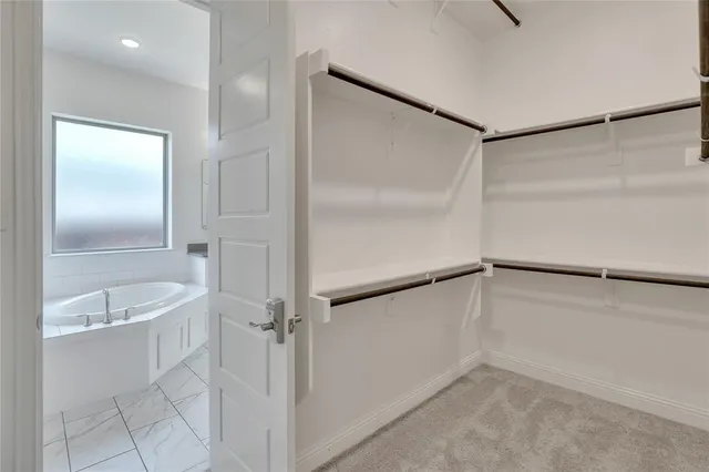 a bathroom with a tub and a shower