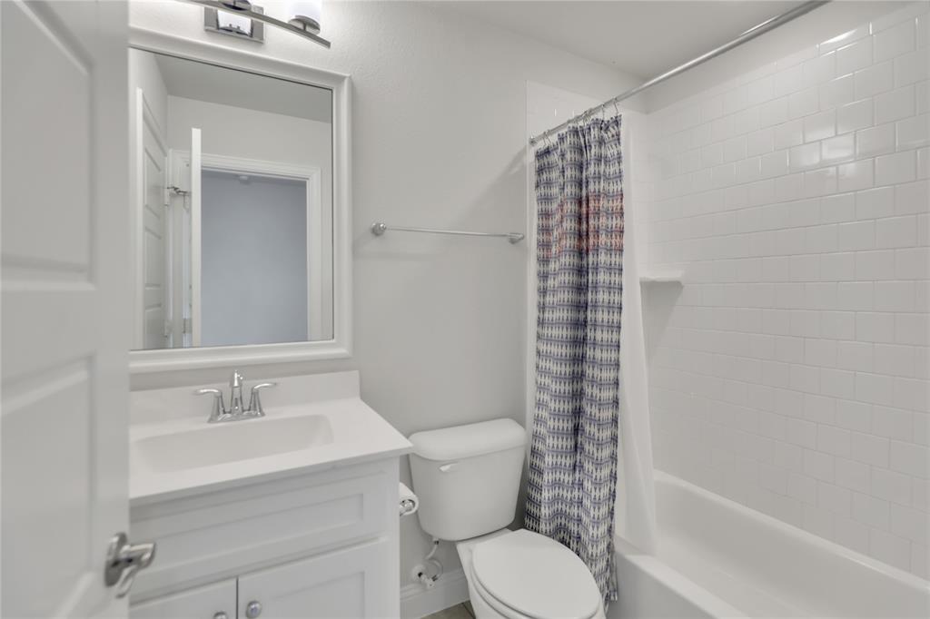 3811 Pepper Grass Lane Prosper, TX 75078 - Photo 38 of 40 a bathroom with a sink a toilet and shower