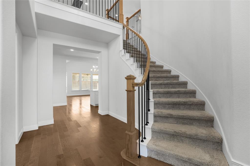 3811 Pepper Grass Lane Prosper, TX 75078 - Photo 9 of 40 a view of entryway and hall with wooden floor